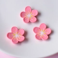 Three pink resin peach blossom charms for DIY hair accessories and car decor on white plate - Water Red Five-Petal