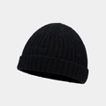 Close-up of black ribbed knit beanie showing the detailed vertical texture and folded cuff - One Size / Black