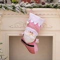 Pink Nordic Christmas stocking with 3D Santa Claus figure in cozy fireplace setting - Santa Claus