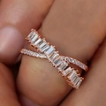 Cross-over ring with baguette and round cubic zirconia in rose gold finish - US 7 / Rose Gold
