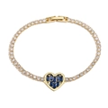 Elegant gold heart bracelet with sparkling blue gemstone and zircon inlay on white base - Gold with Blue Stone