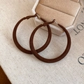 Detailed macro shot of dark brown velvet oval earrings on a rustic textured linen background - Round Stud Earrings / Silver Pin - Dark Coffee Hoop