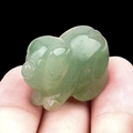Mini hand-carved light green jade pig figurine made of natural aventurine crystal - Green Aventurine