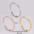 Detail of 4mm stainless steel bangles featuring micro checkered pattern in three colors - Style 4 Small Grid Pattern