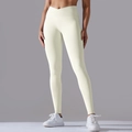 Detail view of cream high-waisted yoga leggings with ribbed V-cross waistband - Milk White