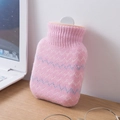 Pink silicone hot water bottle with wavy knit cover on a wooden desk with laptop - 320ml / Simple Style / Pink