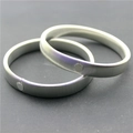 Pair of silver elastic spring metal armbands with textured surface and round buckles - White K/Silver