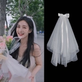 Short double-layer white wedding veil featuring a chic satin bow and pearl accents - Bowknot Multi-layer Mesh Hair Clip (7CM)