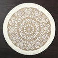 Round jute placemat with white mandala floral print and fringe on dark wood table - 38cm / Fringed Kaleidoscope Flower