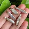Five long baroque pearls with golden edges held in hand for DIY jewelry making - No.29 Width 5-7mm Length 18-28mm