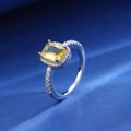 Silver ring featuring a yellow rectangular gemstone with clear zircons on a dark background - Square Style (F107)
