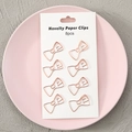 Set of 8 rose gold bow-shaped novelty paper clips on a white display card pack - Bow / Set of 8