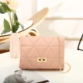 Pink quilted crossbody bag with gold chain strap and metal turn-lock closure - Pink