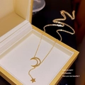 Elegant gold celestial necklace featuring crescent moon and star pendant in gift box - X134 Minimalist Star Moon