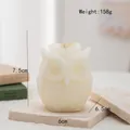 Artistic owl-shaped scented candle in off-white with detailed feather carvings - Closed Eye Owl(65) / Cream White
