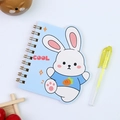 Close-up of blue cartoon rabbit spiral notebook with yellow pen on white surface - Rabbit
