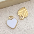 White heart enamel pendant with gold leaf charm on beige textured background - 1Pc White Heart Shape Charm 10x12mm
