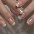 Macro detail of glossy French tips in nude pink and white with a squared-oval shape - Glossy White French Style (CW359)