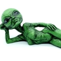 Resin alien figurine in green color lying on its side for garden or home decoration - Reclining Green Alien