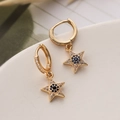 Gold star drop earrings with blue and white zircon stones on a white ceramic base - Gold Star (44131)