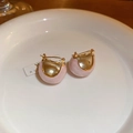 Detail of pink enamel bean earrings in gold plating on a white ceramic plate - Flowing Gold Pink (Genuine Gold Plated)