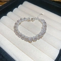 Detail view of double-layer beaded bracelet with pearls and purple crystal beads in jewelry box - Silver Purple Crystal Pearl Bracelet / Silver Purple