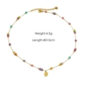 Dettaglio della collana con perline e conchiglia con specifiche di peso 4.5g e lunghezza - N12 Perline Piatte Miste