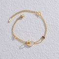 14K gold-plated double-layer heart bracelet with white shell and infinity charm on white marble - Gold Heart Bracelet