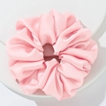 Oversized pink satin scrunchie with a silk-like glossy finish and soft fabric folds - Pink