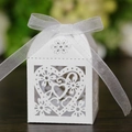 Close-up of laser-cut heart favor box in white cardstock with silver satin ribbon - White