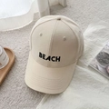 Detailed view of beige cotton baseball cap featuring high-quality BEACH letter embroidery - 56-65cm (Adjustable) / BEACH Embroidery / White