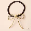 Elastic hair tie with 6cm diameter featuring a minimalist golden metal bow decoration - Gold Ribbon Bow