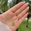 Close-up of 18K gold plated bear pendant with sparkling green zircon pavé stones - Green