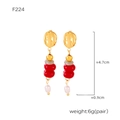 Detail view of gold ring earrings with red beads and white pearls, sized 4.7cm x 0.9cm - F224 / Red