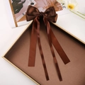 Elegant coffee brown satin ribbon bow hair clip with long streamers on a vintage tray - Red Brown