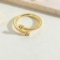 Detailed macro view of a gold clover ring set with colorful stones and sparkling zircons - Multi-color Zirconia Style