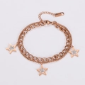 Detalle de pulsera de doble capa en oro rosa con estrellas e incrustaciones de circonio - Oro rosa