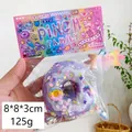 Lila Donut-Quetschspielzeug mit Pailletten und Sternen in der Originalverpackung - Lila Donut mit Biss