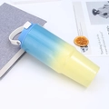 Close-up of 30oz blue and yellow gradient stainless steel tumbler with handle and lid - Blue & Yellow