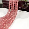 Polished translucent pink round beads for jewelry making, 45-degree angle view - Watermelon Red 50 / 6mm / Approx 63pcs