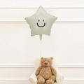 Star-shaped green foil balloon with a smile face floating over a teddy bear scene - Star + Smile Sticker / Cream