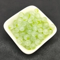 Detailed close-up of 8mm round translucent light green glass beads in a white bowl - 8mm / A13# Light Green (8MM)