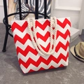 Ethnic style tote bag with red and white chevron canvas patterns and beige rope handles - Red Wave