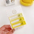 Three gradient yellow rectangle hair clips on a white display card with gold dots - Yellow Square Set
