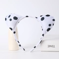 Detail view of plush dalmatian dog ears headband with black spots on white fabric - Dalmatian Short Ears