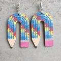 Detail of wooden pencil earrings with colorful puzzle pattern and vibrant painted eraser tip - Puzzle Pattern Pencil