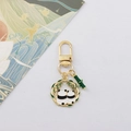 Detail van gouden panda sleutelhanger met bamboering en panda koppel decoratie - Panda Achteraanzicht Stijl (5)