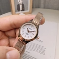 Elegant rose gold women's quartz watch with Milanese mesh strap and minimalist white dial - White Face