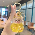 Golden liquid sand Maneki Neko keychain with yellow sequins and a small gold bell charm - Lucky Cat Flash - Yellow / Individual Packaging