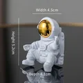 White astronaut figurine with gold visor and size markings, height 5.2cm - No.11 Gold Astronaut / 4.5x5.2x4.1cm